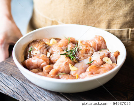 Raw diet marinated turkey meat with garlic, ginger and teriyaki sauce  64987035