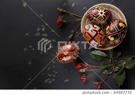 Easter eggs decorated with wax resist technique 64987776