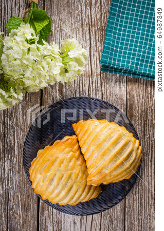 Puff pastry apple. 64987849