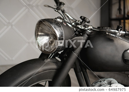 Motorcycle close-up in room. Photo from the studio 64987975