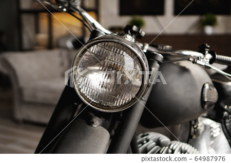 Motorcycle close-up in room. Photo from the studio 64987976