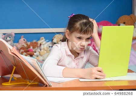 Upset girl dissatisfied with distance learning 64988268
