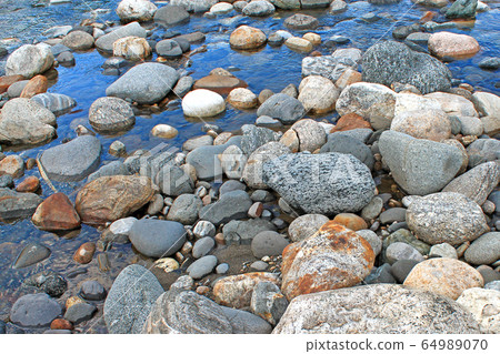 Green river stones background on white background Green river stones background on white background 64989070