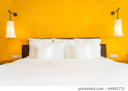 White pillow on bed decoration interior of bedroom White pillow on bed decoration interior of bedroom 64992731