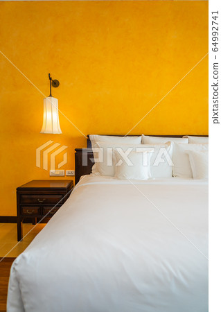 White pillow on bed decoration interior of bedroom White pillow on bed decoration interior of bedroom 64992741