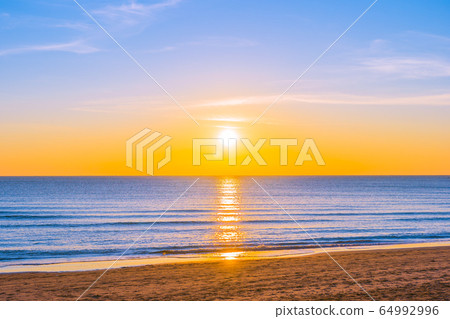 Beautiful tropical nature beach sea ocean at sunset or sunrise Beautiful tropical nature beach sea ocean at sunset or sunrise 64992996