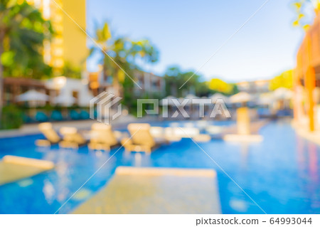 Abstract blur and defocus outdoor swimming pool in hotel resort for background Abstract blur and defocus outdoor swimming pool in hotel resort for background 64993044