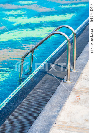 Stair around outdoor swimming pool in hotel resort Stair around outdoor swimming pool in hotel resort 64993049