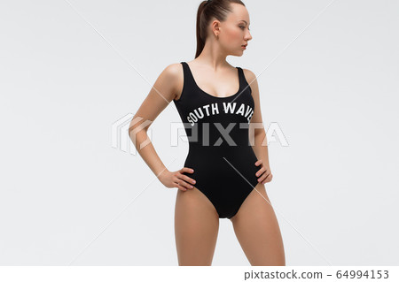 Hot woman in beachwear looking at camera Hot woman in beachwear looking at camera 64994153