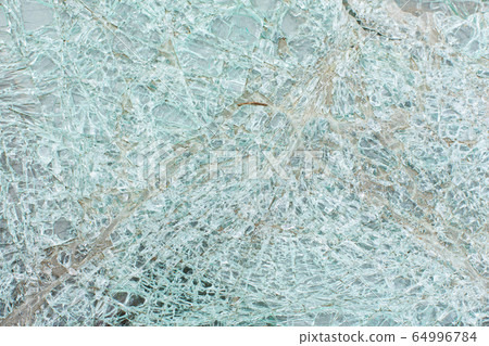 Broken car glass after an accident close up Broken car glass after an accident close up 64996784