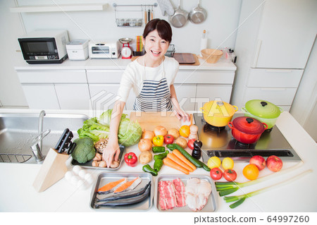 Kitchen cooking woman housewife cooking class high angle lifestyle Kitchen cooking woman housewife cooking class high angle lifestyle 64997260