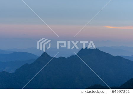 High angle viewpoint sunset over mountains and High angle viewpoint sunset over mountains and 64997261
