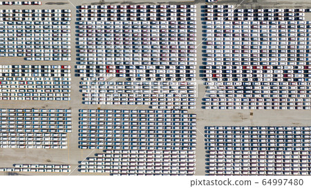 Aerial view Lot of vehicles on parking for new car Aerial view Lot of vehicles on parking for new car 64997480
