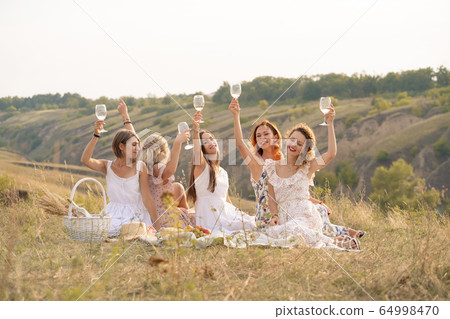 The company of female friends having fun and 64998470
