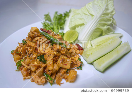 Herbal chili paste, spicy and fresh vegetables are Thai style food. Herbal chili paste, spicy and fresh vegetables are Thai style food. 64999789