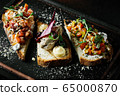 Delicious Italian bruschetta with tomato, meat pate, olives, cream cheese. Set of tasty appetizer sandwiches. 65000870
