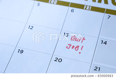 Quit job words written on table calendar with red 65000983