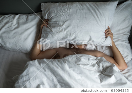 Caucasian man suffering from insomnia Caucasian man suffering from insomnia 65004325