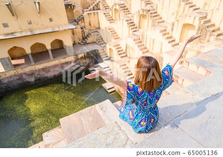 Portrait of young woman in Panna Meena ka Kund step-well Portrait of young woman in Panna Meena ka Kund step-well 65005136