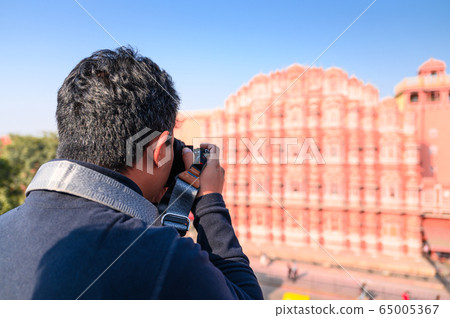 Photographer capturing photo of Hawa Mahal or Palace of the Winds in Jaipur, India Photographer capturing photo of Hawa Mahal or Palace of the Winds in Jaipur, India 65005367