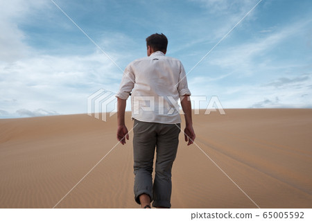 Caucasian young man going straight on his way on 65005592