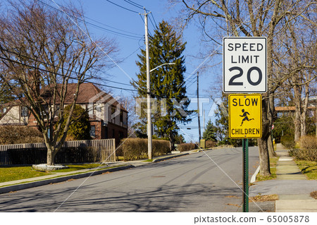 Road sign displaying 20 mph speed limit warning 65005878