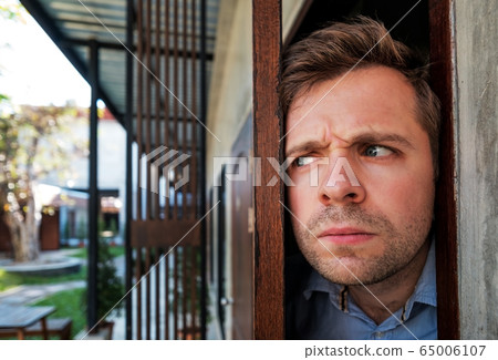 Cropped shot of senior man spying and entering Cropped shot of senior man spying and entering 65006107