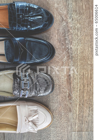 Loafers and other shoes retro style stand on the wooden floor. Loafers and other shoes retro style stand on the wooden floor. 65006614