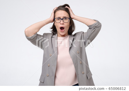 young angry shocked woman in glasses holding hands young angry shocked woman in glasses holding hands 65006812