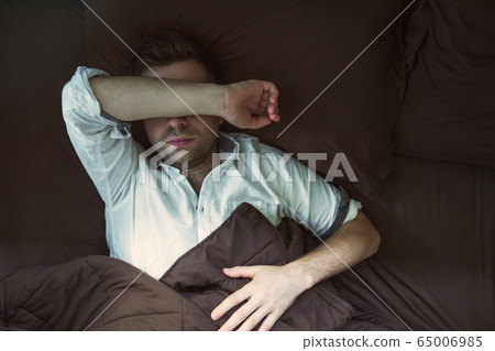 Portrait of a young caucasian man from above Portrait of a young caucasian man from above 65006985