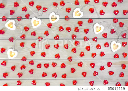 hearts garland on a wooden background top view hearts garland on a wooden background top view 65014639