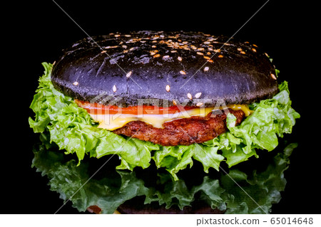 black hamburger close up on a black background black hamburger close up on a black background 65014648