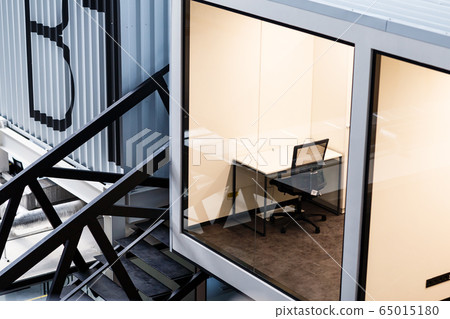 View on office room with transparent wall, open space IT 65015180