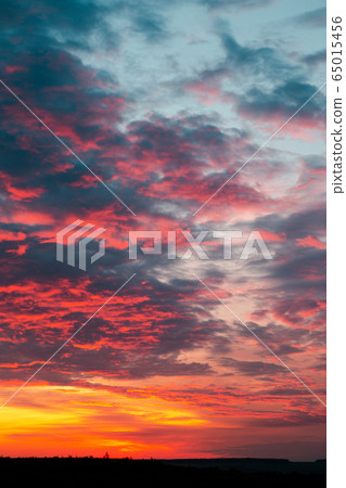 Beautiful fiery orange sunset sky with horizon Beautiful fiery orange sunset sky with horizon 65015456