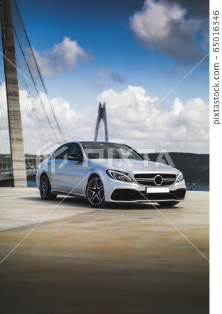 White sport sedan test drive at the seaside 65016346