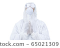 medic man wearing protective clothing against the virus is pray  65021309