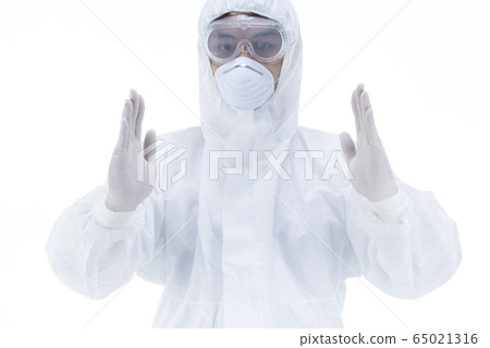 Doctor with protective clothing presenting blank palm of her hand 65021316