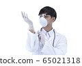 young asian doctor wearing medical gloves. 65021318