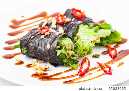 Raw vegan nori hand rolls with sauce, salad and Raw vegan nori hand rolls with sauce, salad and 65022665