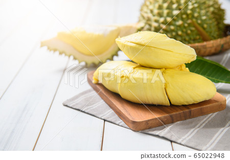 Fresh durian (monthong) on sack and white wood 65022948
