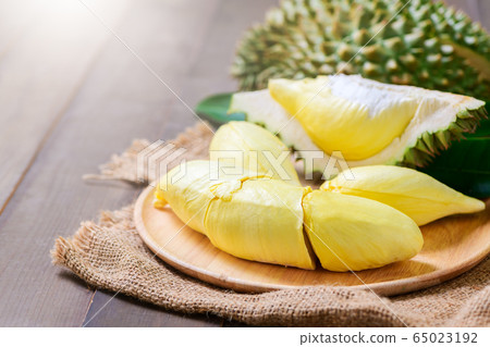 Fresh durian (monthong) on sack and old wood 65023192