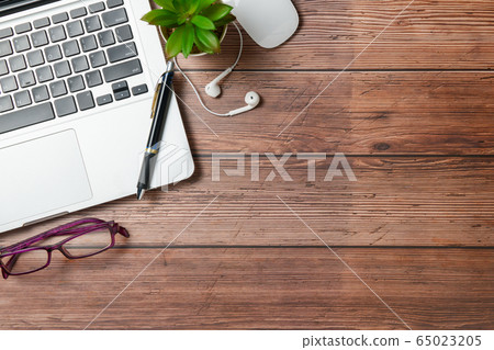 Old wood desk table with laptop computer, pen and Old wood desk table with laptop computer, pen and 65023205