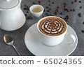 macchiato coffee with flower art on top coffee 65024365