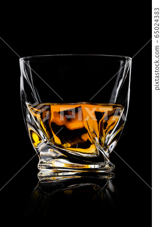 Scotch whiskey in crystal modern luxury glass on 65024383