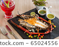 Grilled Lobster and souce on plate. 65024556