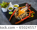 Grilled Lobster and seafood souce on plate. 65024557