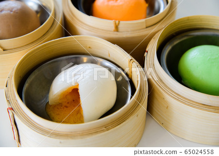 Chinese Salted Egg Bao (Bun), Yolk Flowing out of Chinese Salted Egg Bao (Bun), Yolk Flowing out of 65024558