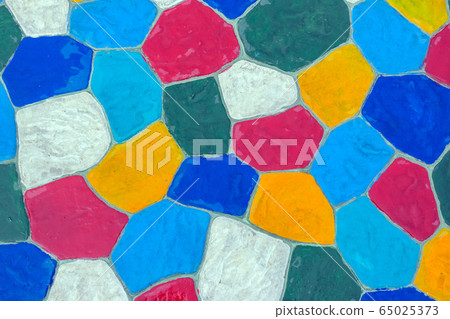 The walkway in the garden are paved with brightly colored stones and have just been cleaned by washing with water. 65025373