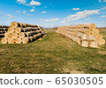 Yellow rolls of straw in the end of summer 65030505