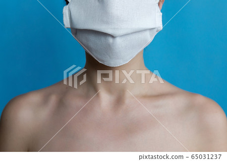 girl without a face stands in a medical mask in a hospital girl without a face stands in a medical mask in a hospital 65031237